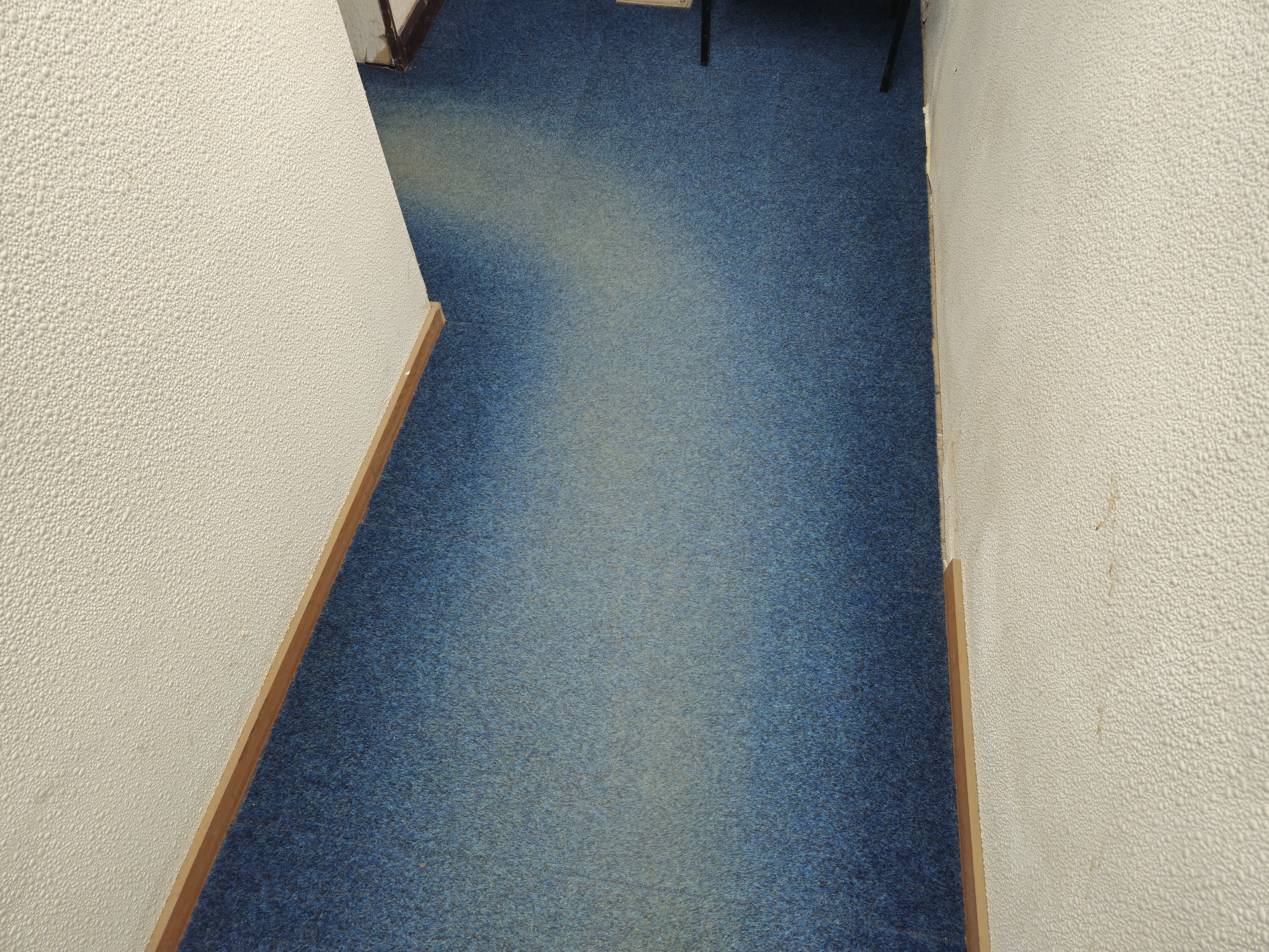 Carpet tiles before cleaning - faded colour and embedded dirt